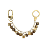 Louis Vuitton Gold & Brown Pestilles Key Chain Bag Charm - Morely TrendsLouis Vuitton Type here:)